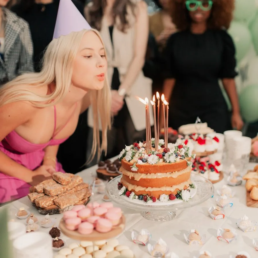 Friends celebrating a birthday with cake
